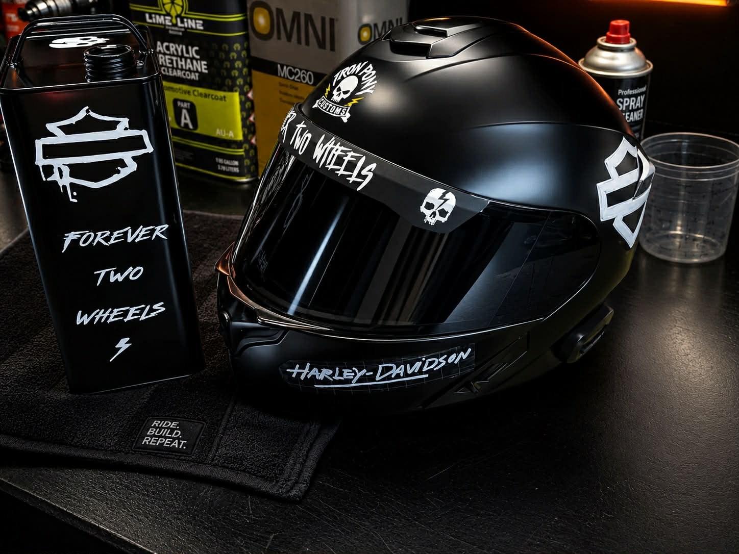 Matte-black custom motorcycle helmet with the Iron Pony skull graphic